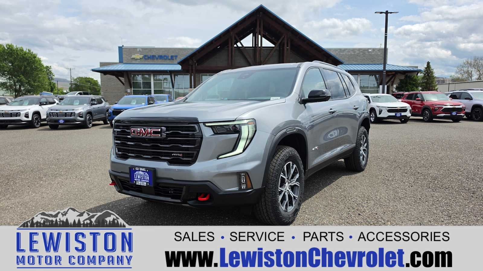 2026 GMC Acadia AT4 in Sterling Metallic — front three-quarter view