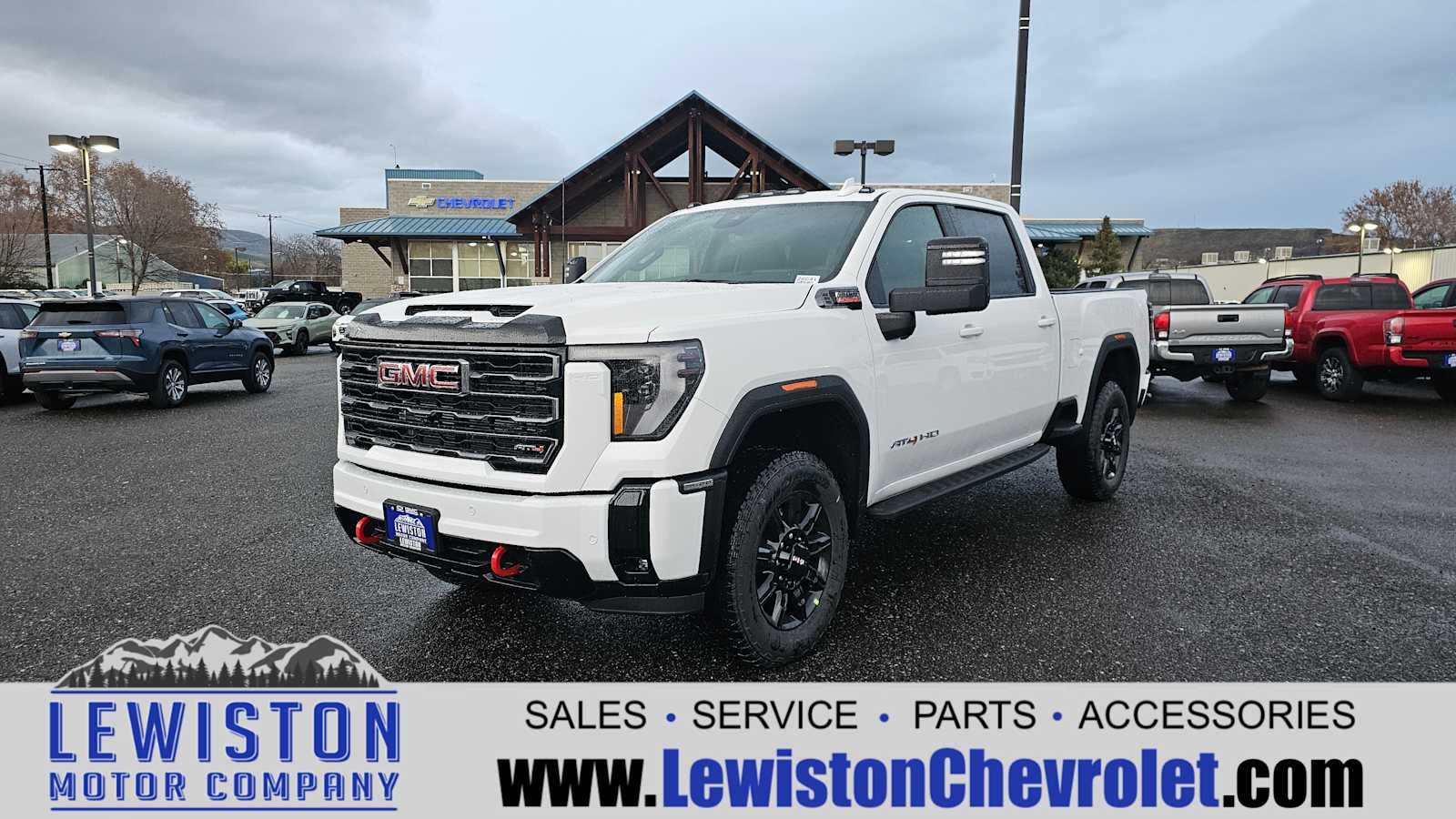 2026 GMC Sierra 3500 HD AT4 in Summit White — front three-quarter view