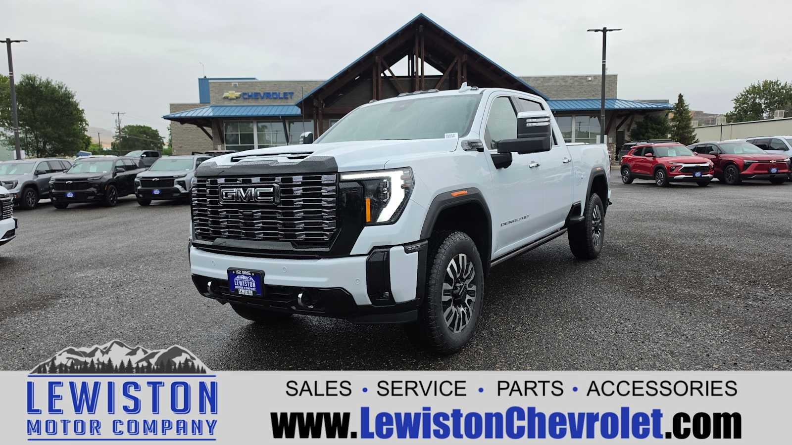 2026 GMC Sierra 3500 HD Denali Ultimate in Glacier White Tricoat — front three-quarter view