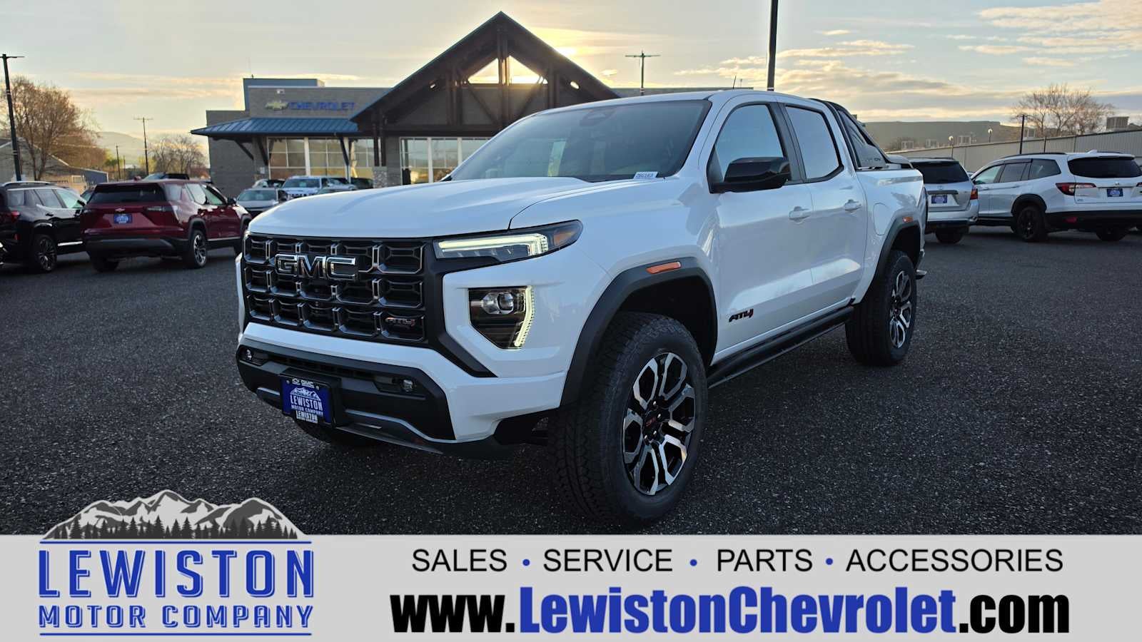 2026 GMC Canyon AT4 in Summit White — front three-quarter view