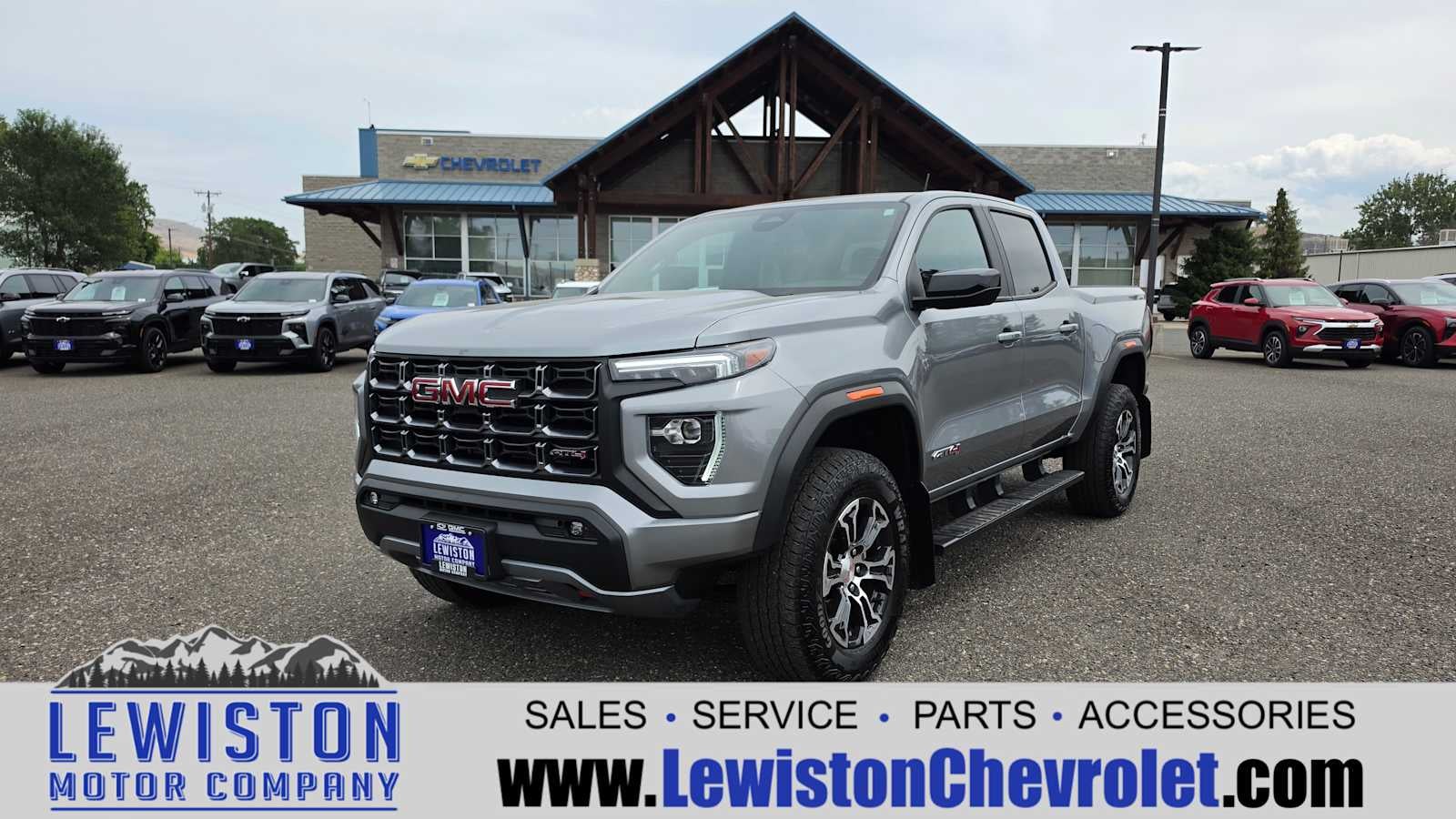 2025 GMC Canyon AT4 in Sterling Metallic — front three-quarter view