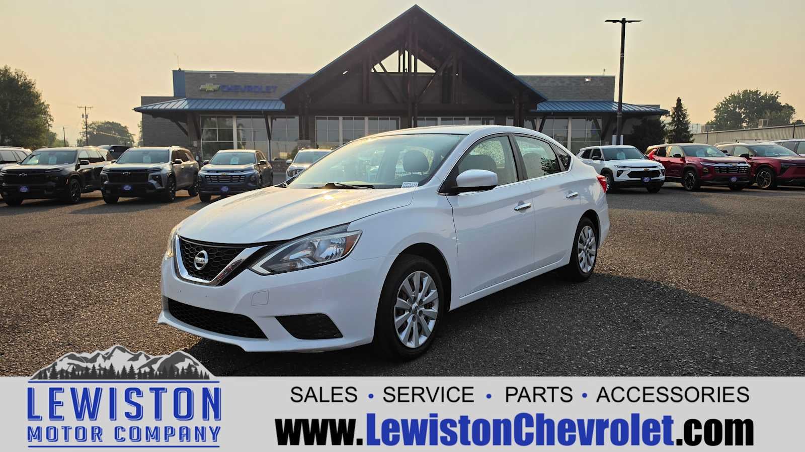 2016 Nissan Sentra SV in White — front three-quarter view