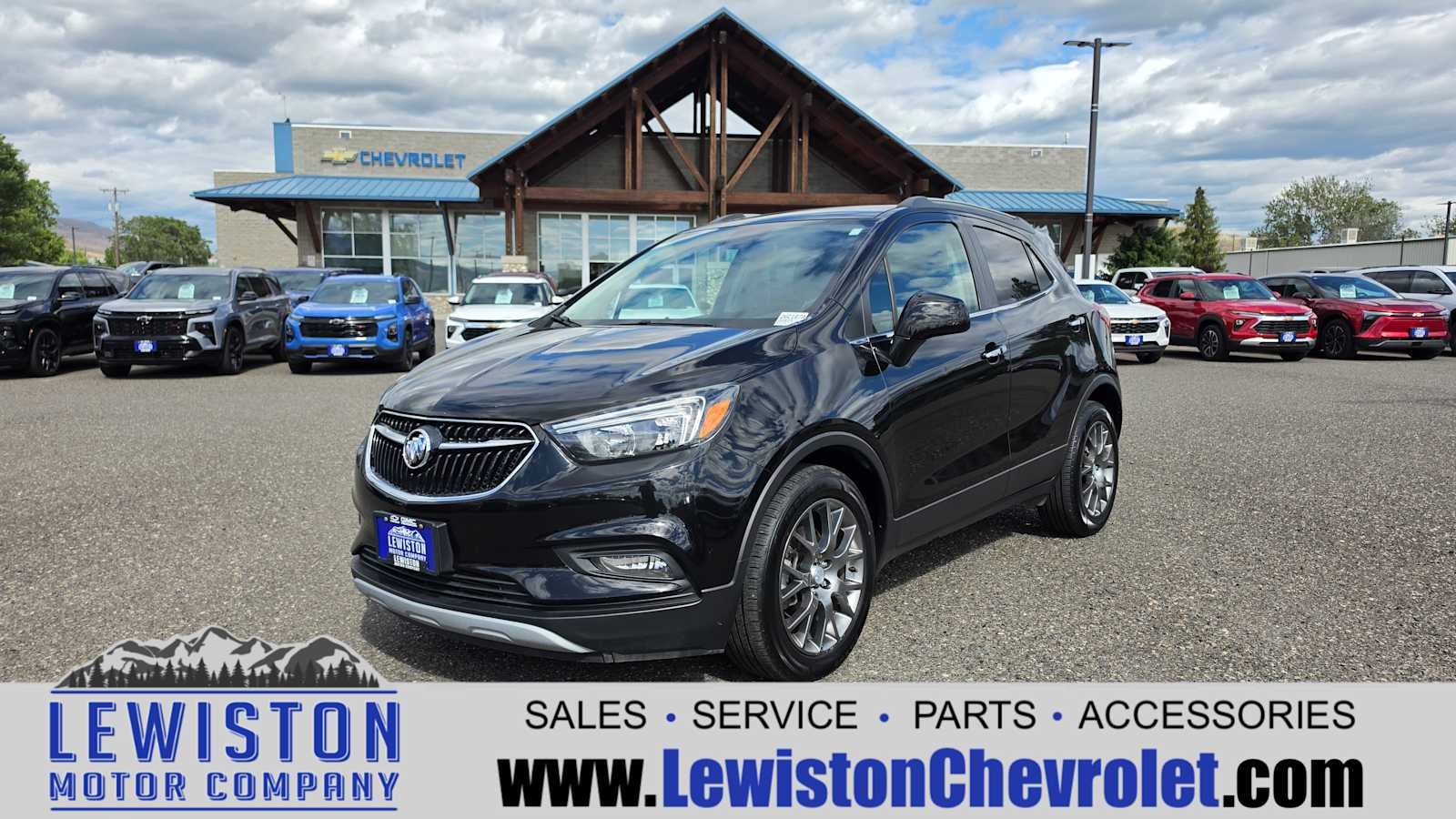 2020 Buick Encore Sport Touring in Includes (Mdp) Anthracite Lower Exterior Accent Color, Paint Code W598f. — front three-quarter view